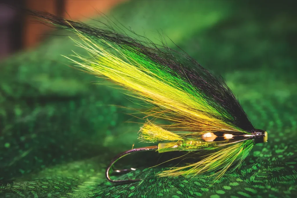 A classic green fly on a black cloth.
